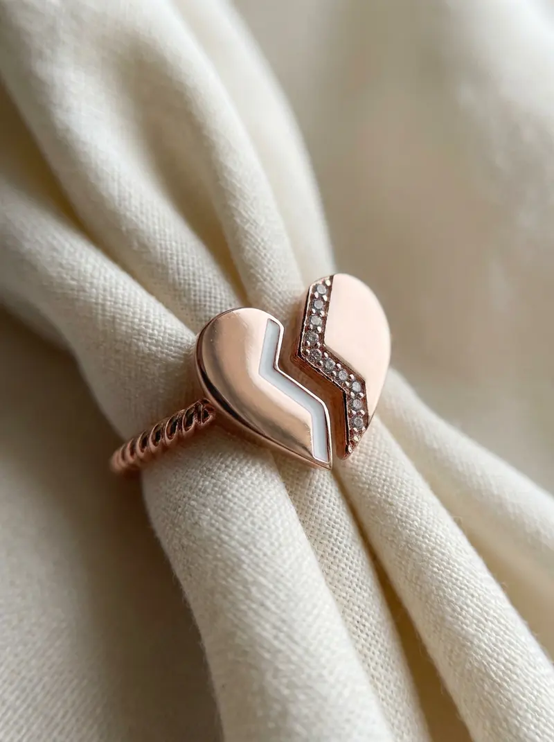Close-up of the broken heart ring on folded linen