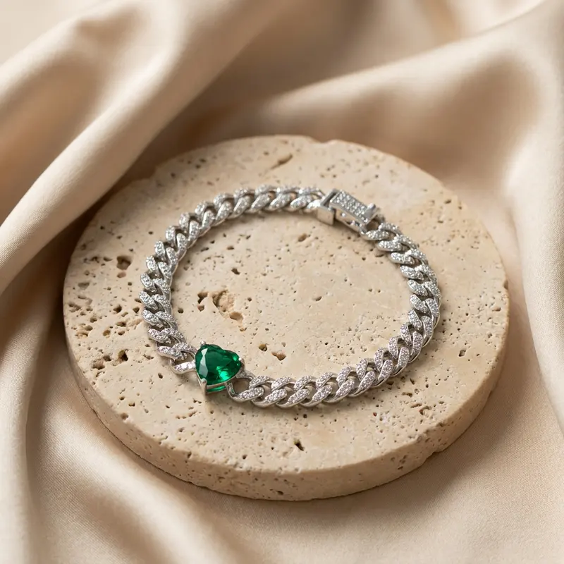 Emerald heart pavé curb bracelet on a travertine disc with silk