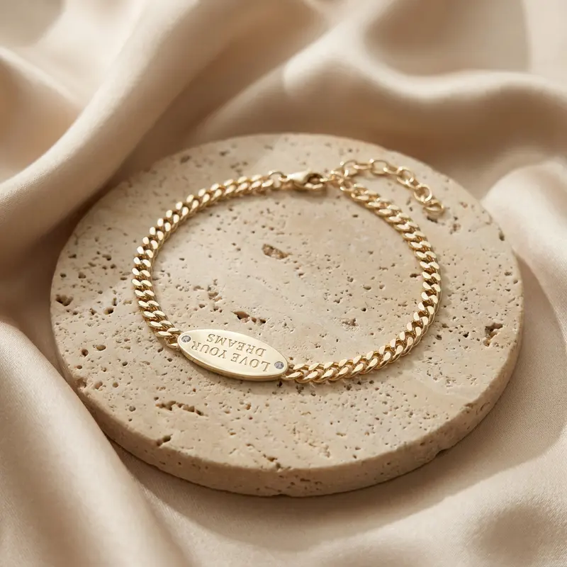 Love Your Dreams ID bracelet on a travertine disc with silk