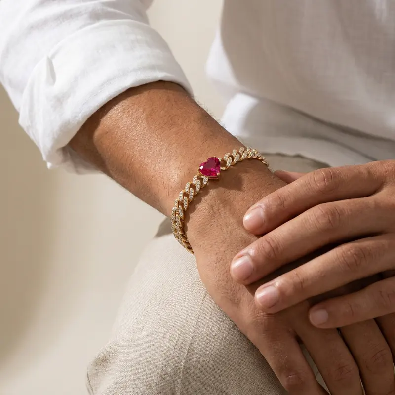 Pink heart curb bracelet worn on a wrist