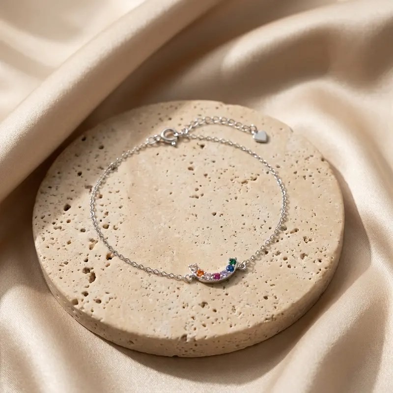 Rainbow arc bracelet on a travertine disc with silk